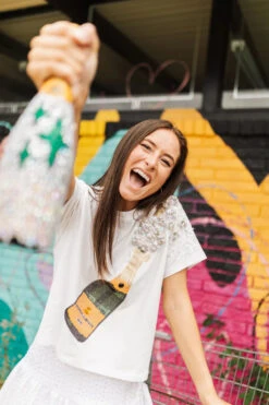 QUEEN OF SPARKLES WHITE CHAMPAGNE TEE -Johnny Corral Shop image 720x d590a1d6 606a 492d b313 fd220337358c